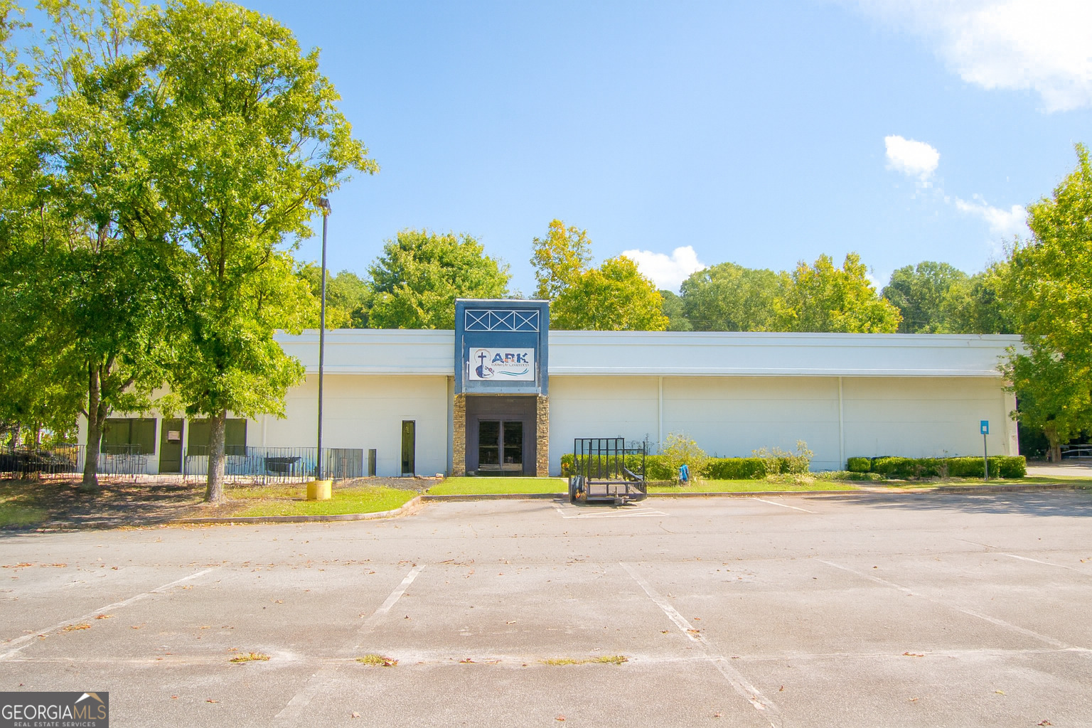 6835 Victory Drive, front elevation and paved parking
